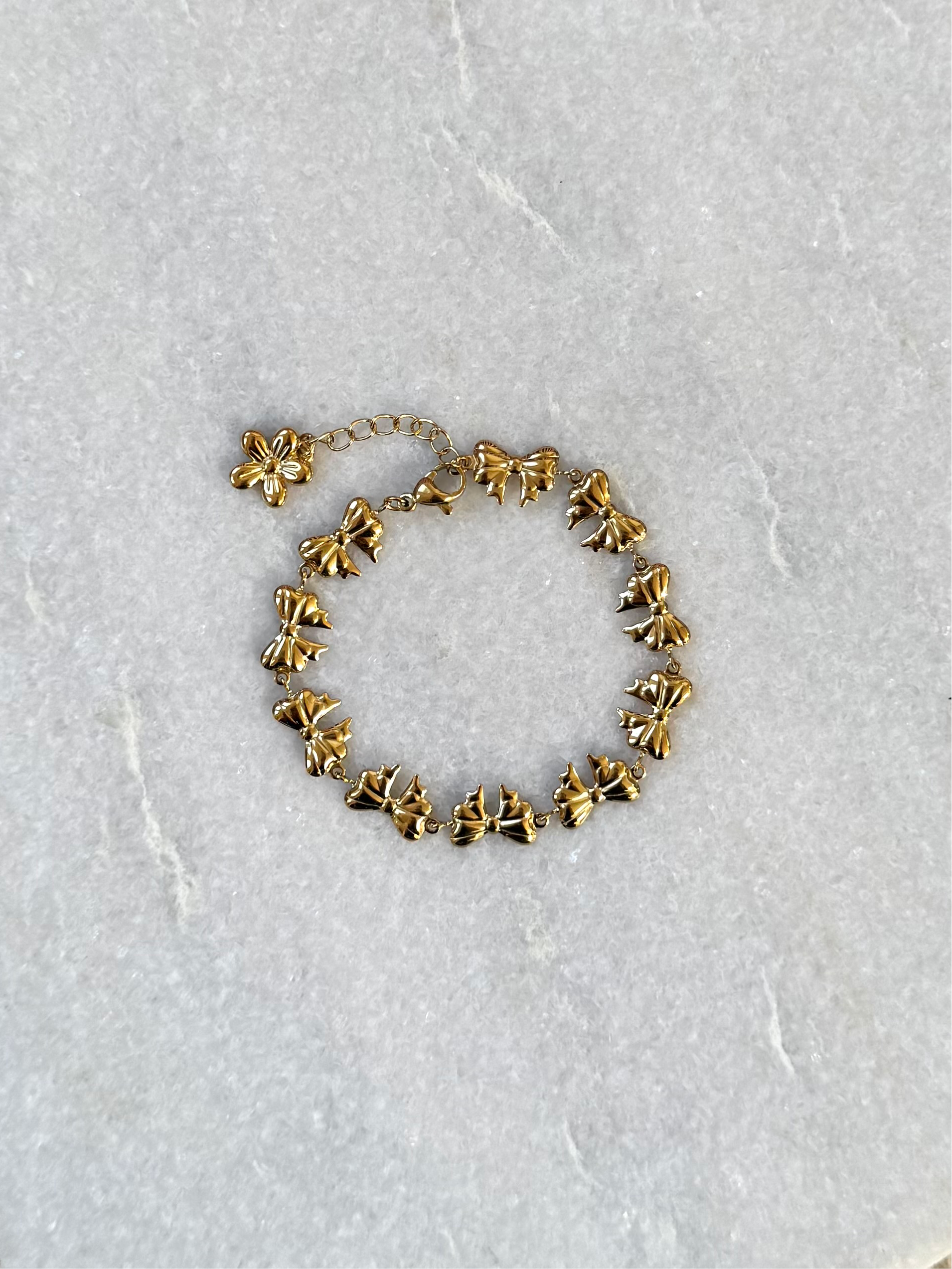 Gouden armband met strikjes | Roestvrijstalen armband met strikjes | Strik armband